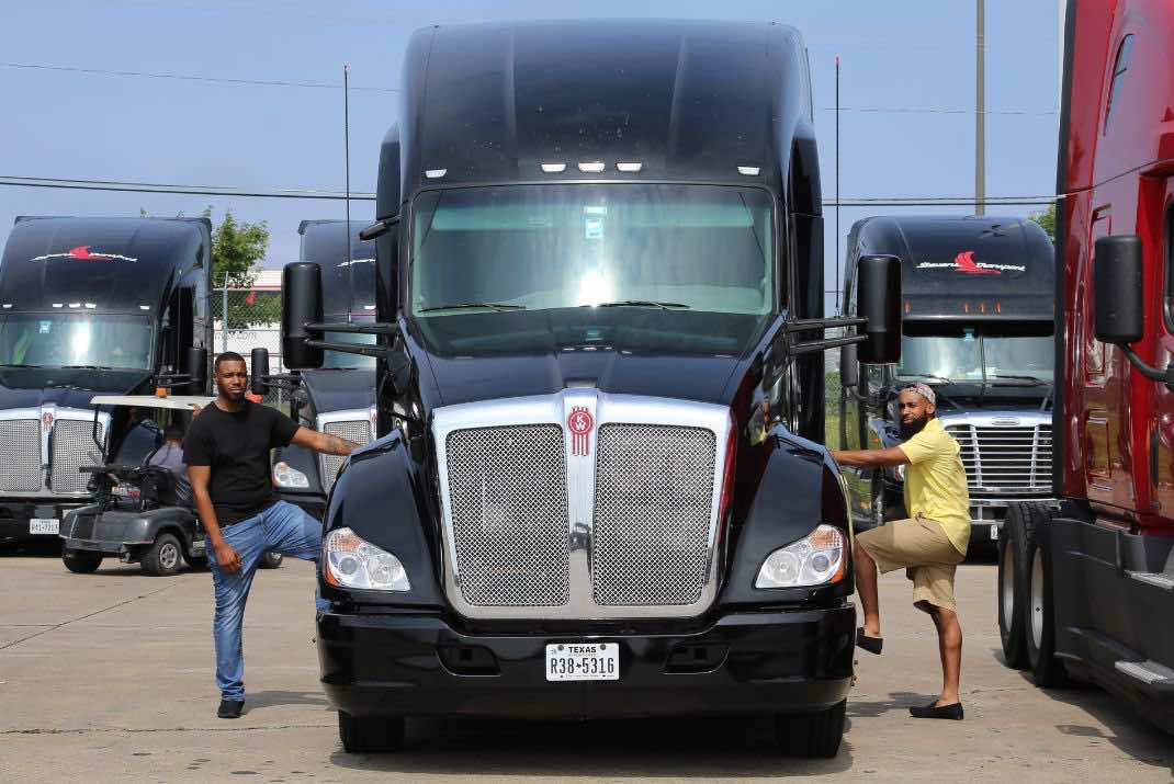 Image of team drivers Demarcus Morris and Maurice Reynolds next to their truck