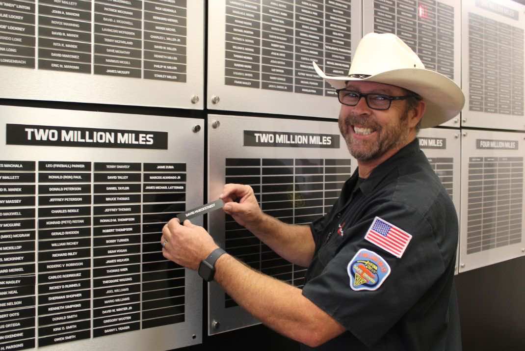 Image of David Hueckstaedt adding his name to the two million mile board