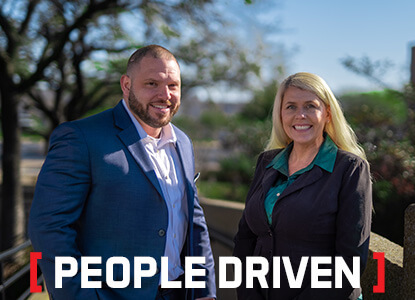 Image of two Stevens employees with the words "People driven" at the bottom