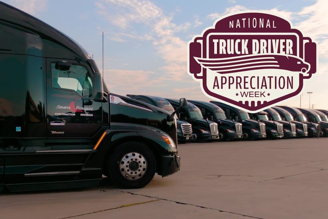 Image of one Stevens Transport truck up close and multiple Stevens Transport semi trucks lined up behind
