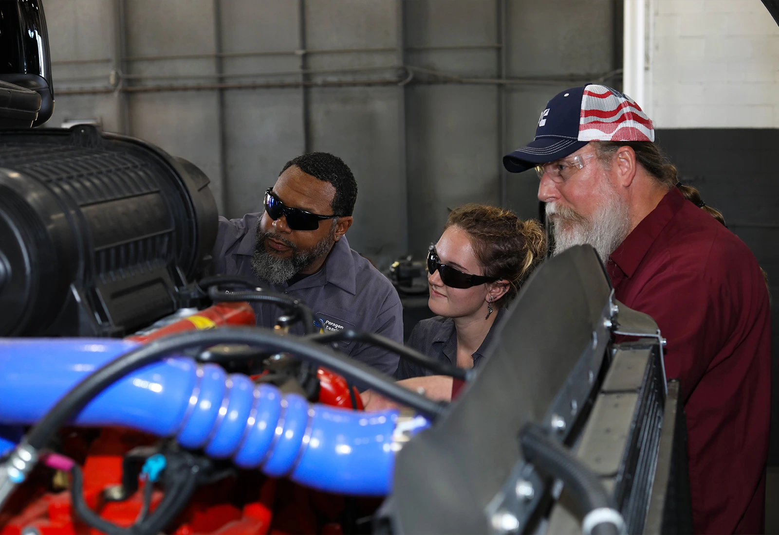 Fleet maintenance crew looking at inside of truck cab